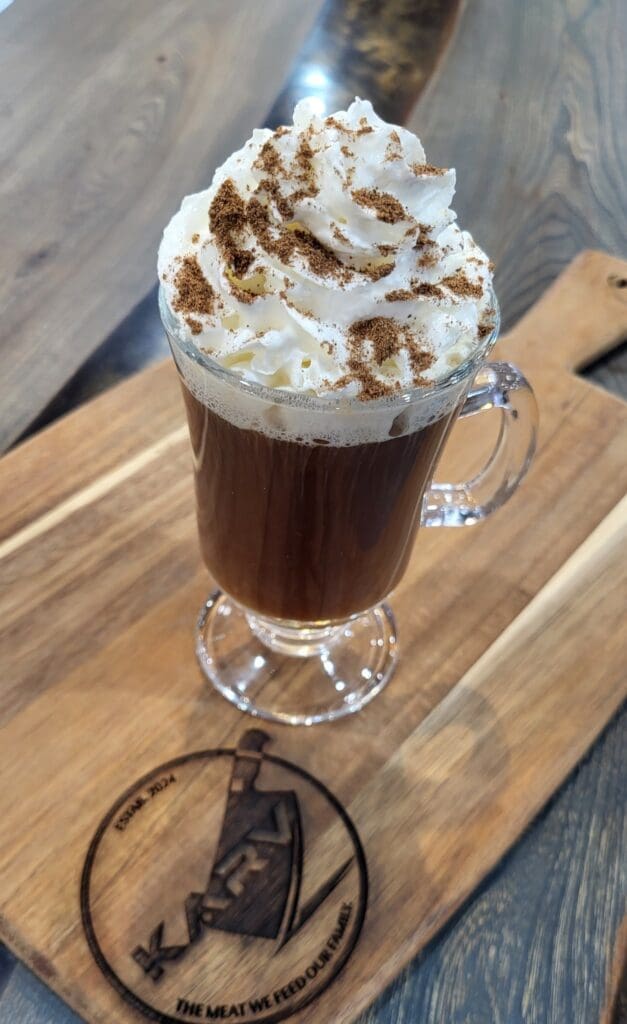 Craft beer taps and specialty cocktails at KARV Meats in Corydon, Indiana, featuring Irish coffee, hot toddy cocktails, and a rotating selection of draft beers, highlighting warmth, comfort, and handcrafted flavor at the KARV Meats bar.